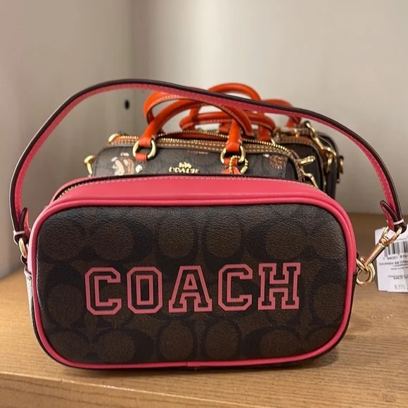 Coach Jamie Wristlet In Signature Canvas With Varsity Motif
IM/Brown/Watermelon - Picture 10 of 16